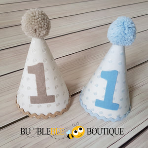 Hobnail Dots party hats in blue and beige