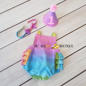 Pastel Rainbow gradations Girls Cake Smash Outfit - Frilly romper, headband & party hat Pink/blue tones front view