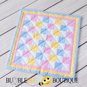Baby Dots pink, blue & yellow mini patchwork quilt front