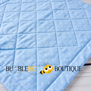 Close-up of Baby Dots pink, blue & yellow mini patchwork quilt back